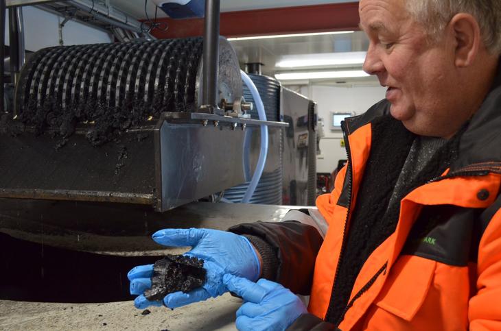 Operator holdning slug containing pollutants removed from leachate